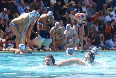 Bishops, Western Province and SA Schools' coach Jabulani Sibiya advises his Western Province team, which produced six SA Schools players, during the final of the 2023 IPT, while Central Gauteng's Greg Pryce, the Defender of the Tournament, swims past in the foreground.